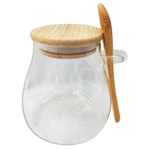 Frasco de vidrio con cuchara y tapa de madera